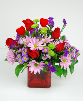 Your love will know it’s true when they receive this ruby glass cube filled with a mixture of red roses