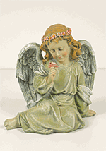 Angel holding flowers and measures 12x7