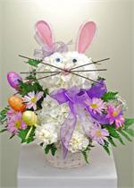A perfect gift for the young and young at heart, the LaRosa's Easter flower Bunny. Designed with white Hydrangea and long lasting white carnations, we added pink and white satin ears, eyes, a pink nose and whiskers. We didn't stop there, we also added a b