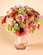 White Calla Lillies with pink roses and white dendrobium orchids and hypericum berries and hand wrapped with matching ribbons.
