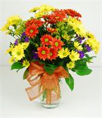Glass garden vase filled with all of the colors of Autumn.