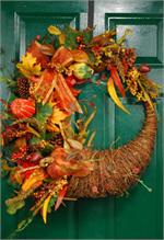 Celebrate the Autumn season with a this stylish Cornucopia wreath. Crafted from vibrant silk leaves in mid-season shades and clusters of faux berries and colorful pumpkins and gourds, it makes a fabulous surprise for hostesses, or better yet, why not orde