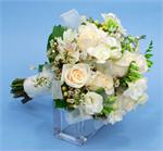 Classic hand tied wedding bouquet with white roses, white freesia, white wax flower, white hypericunm berries, and tied with whit sheer ribbons.