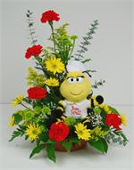 Someone not feeling well? Let our bee well bee convey your get well wishes. This charming bee is sitting in a garden of red carnations, with yellow spray dasies, yellow solid ago, green button mums with baby blue eucalyptus, mixed greenery and just a touc