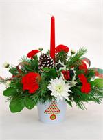 Let our Holiday Messenger arrangement send your greetings this holiday season. Brightly colored red and white carnations with a mixture of holiday greenery, stems of holly, pine cones, red wired holiday ribbons, and a red tapered candle all arranged in a 