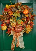 Celebrate Autumn with a this stylish faux wreath. Crafted from vibrant silk leaves in mid-season shades and clusters of faux berries and colorful pumpkins it makes a fabulous surprise for hostesses, or better yet, why not order one for yourself and welcom
