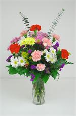Sending flowers conveys our thoughts and feelings at a time when words often fail us. It’s not always the size of the arrangement but the message that it conveys. Our “Memory Vase” is designed with red and pink carnations, with white, yellow...