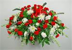 Peaceful Passage Casket Piece, is arranged with white spider mums with red roses, red carnations, white stock, baby eucalyptus and mixed greens and matching ribbons with choice of script.