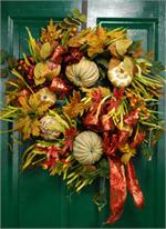 Welcome family and friends this season with our lovely faux harvest wreath. Designed with  pumpkins, gourds, berries and fall leaves, it's a truly original gift for decorating for the up coming seasonal get-togethers.