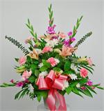 Sending flowers for a friend or loved one at this difficult time shows that you care. Words often fail us, but flowers can convey our thoughts. Soft Expressions is a container arrangement with stargazer lilies, pink carnations, white mums, pink gladiolus,