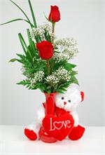 Tickle your sweetheart this Valentine Day with our “tickle me red bear. This soft and cuddly white bear with a red love heart and holding a red bud with two red roses says it all. Don’t keep you valentine waiting call today and your gift will be hand deli